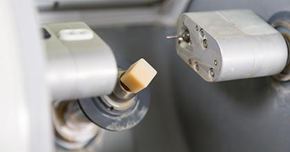 a close-up of a CEREC milling machine