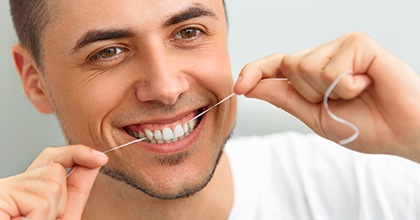 patient smiling while visiting dentist